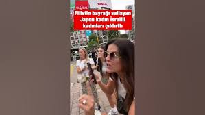 Tokioda bir qadın Fələstin bayrağı qaldırdı, israilli qadınlar dəli oldu!